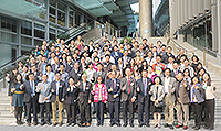 Participants pose for a group photo in front of Yasumoto International Academic Park of CUHK